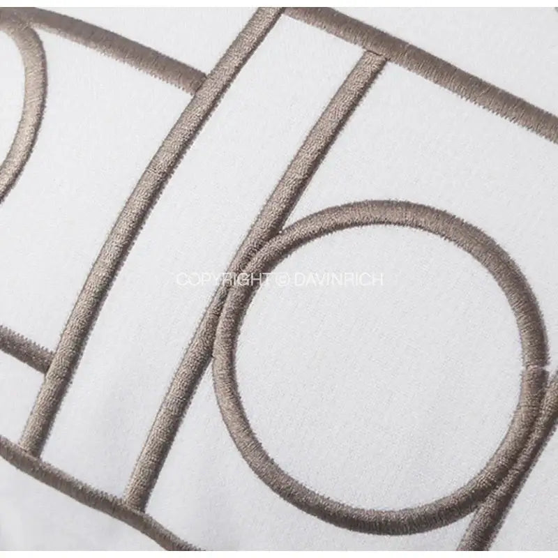 White cushion cover with taupe geometric embroidered noble design featuring lines and circles for living room decorbites cushion covers