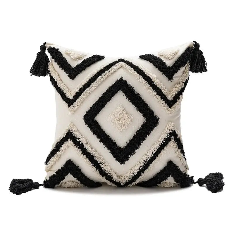 Cream-colored cushion cover with black decorbites geometric embroidery and tassels for boho living room decor