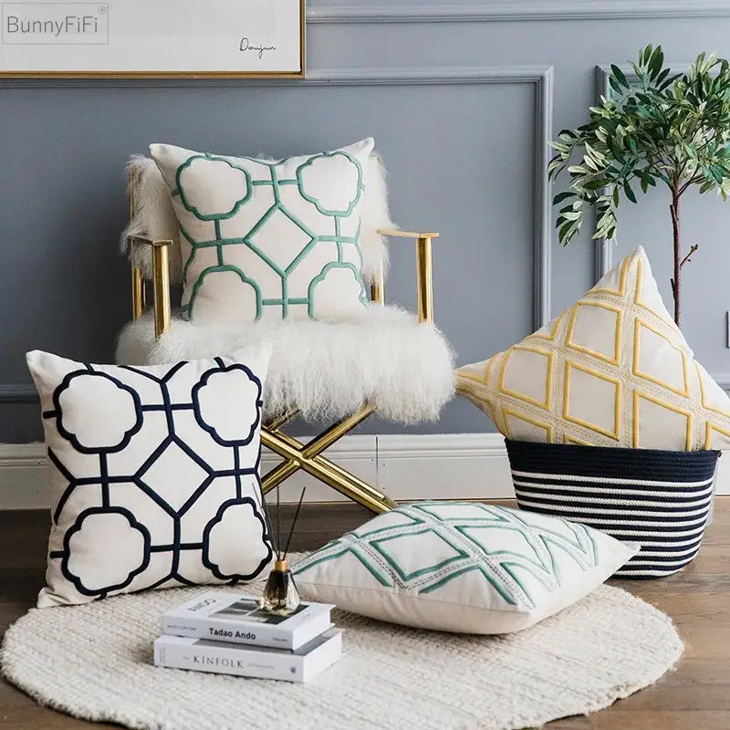 White throw cushion cover with teal and navy blue decorbites geometric embroidery on soft fabric for living room decor