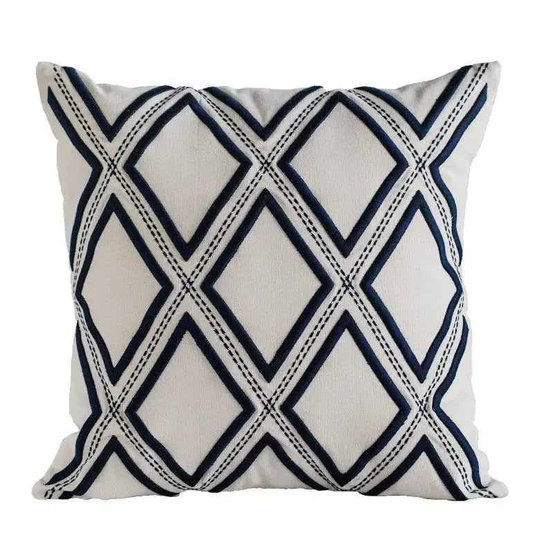 Cream-colored cushion cover with navy blue geometric embroidery diamond pattern decorbites geometric embroidery design