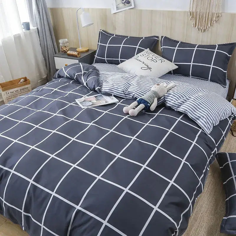 Navy blue and white grid-patterned bedding set with matching pillows from decorbites geometric floral bedding collection