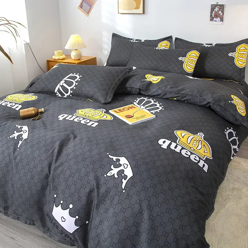 Black queen-themed bedding set with bold yellow and white crown motifs on dark gray fabric by decorbites geometric floral