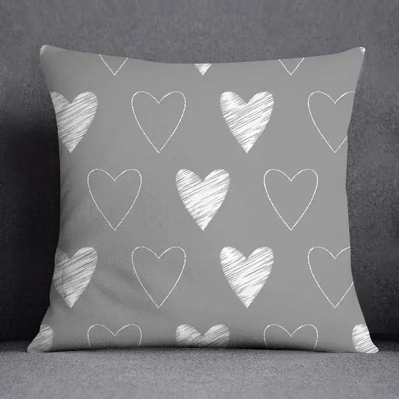 Gray throw pillow case with white chalk-drawn hearts featuring decorbites geometric floral print for living room decor