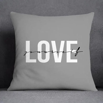 Gray square pillow case with love yourself print in white block and black cursive script for decorbites geometric floral print decor