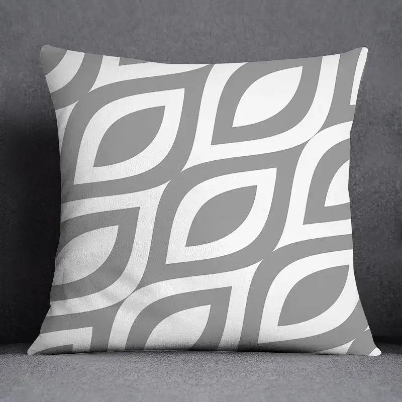 A square pillow case with a decorbites geometric floral print in gray and white for modern living room decor