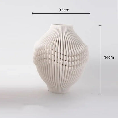 A sleek white geometric folding ceramic vase with ribbed wave-like texture for decorbites living room decor