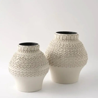 Cream-colored geometric folding ceramic vase with textured woven pattern and black interior for living room decorbites decor