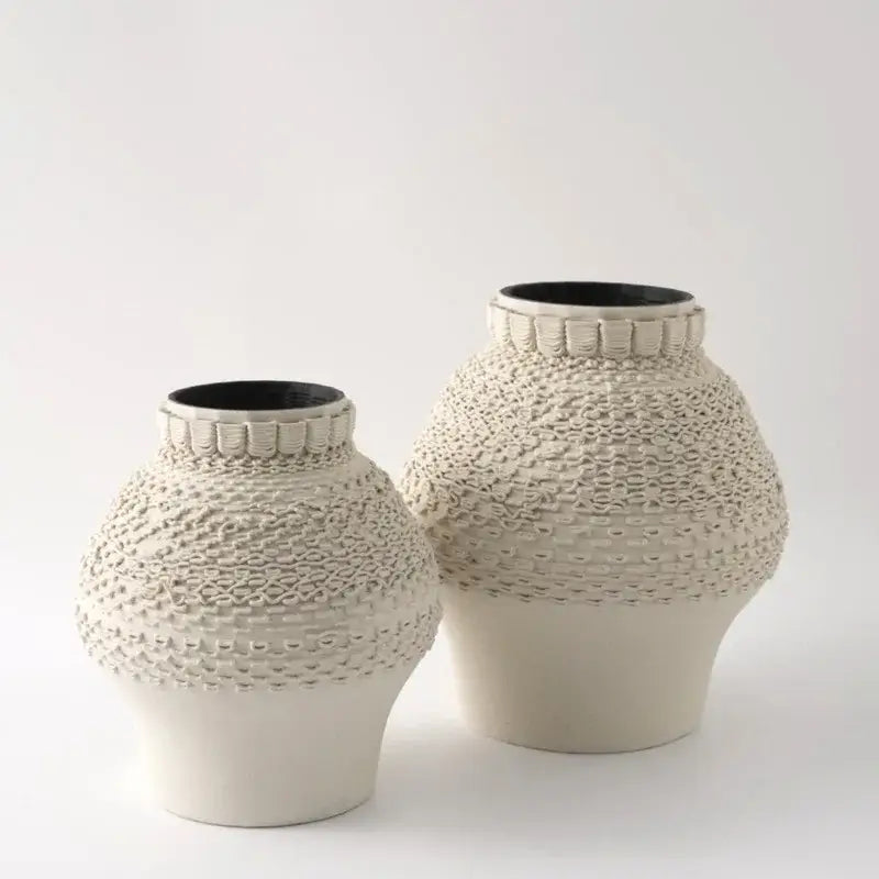 Cream-colored geometric folding ceramic vase with textured woven pattern and black interior for living room decorbites decor