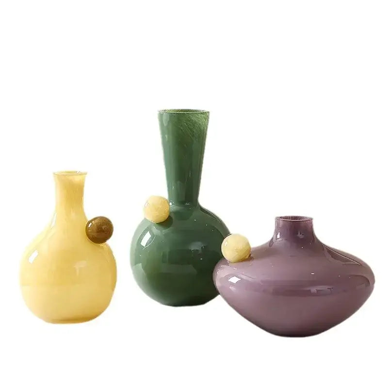 Set of three colorful geometric glass sphere vases with rounded bodies and slender necks for living room decorbites decor