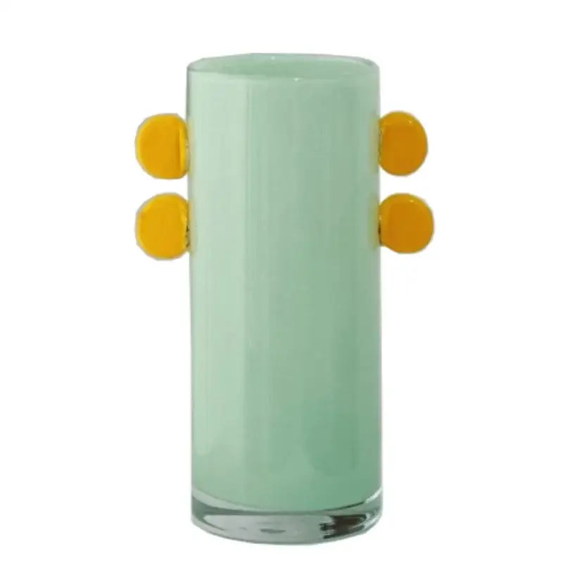 A translucent mint-green color patches decorbites geometric glass vase with four bright yellow circular handles for decor