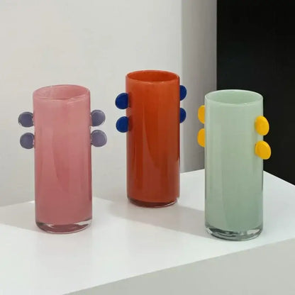Three colorful geometric glass vases with rounded knobs and color patches for decorbites living room decor