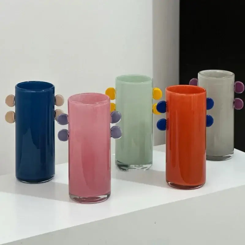 Colorful geometric glass vase with playful rounded handles and vibrant color patches for living room decorbites decor