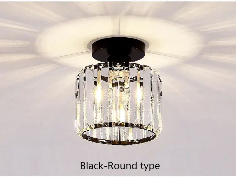 Black round ceiling light with clear crystal prisms and sleek metallic frame from decorbites crystal led chandelier collection