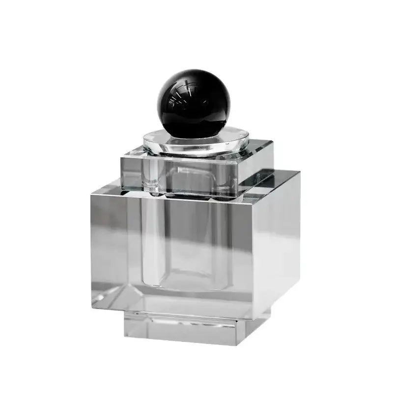 Clear acrylic perfume bottle with geometric glossy black stopper for use with geometric storage jar jewelry box