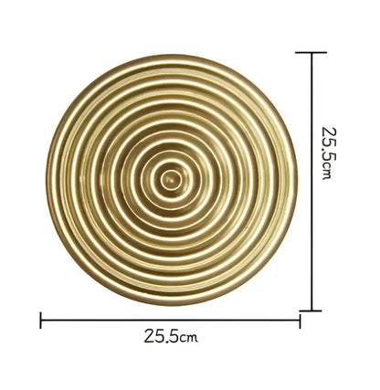Circular brass-colored decorative plate with concentric rings 25.5cm in diameter for geometric golden metal wall decorbites decor