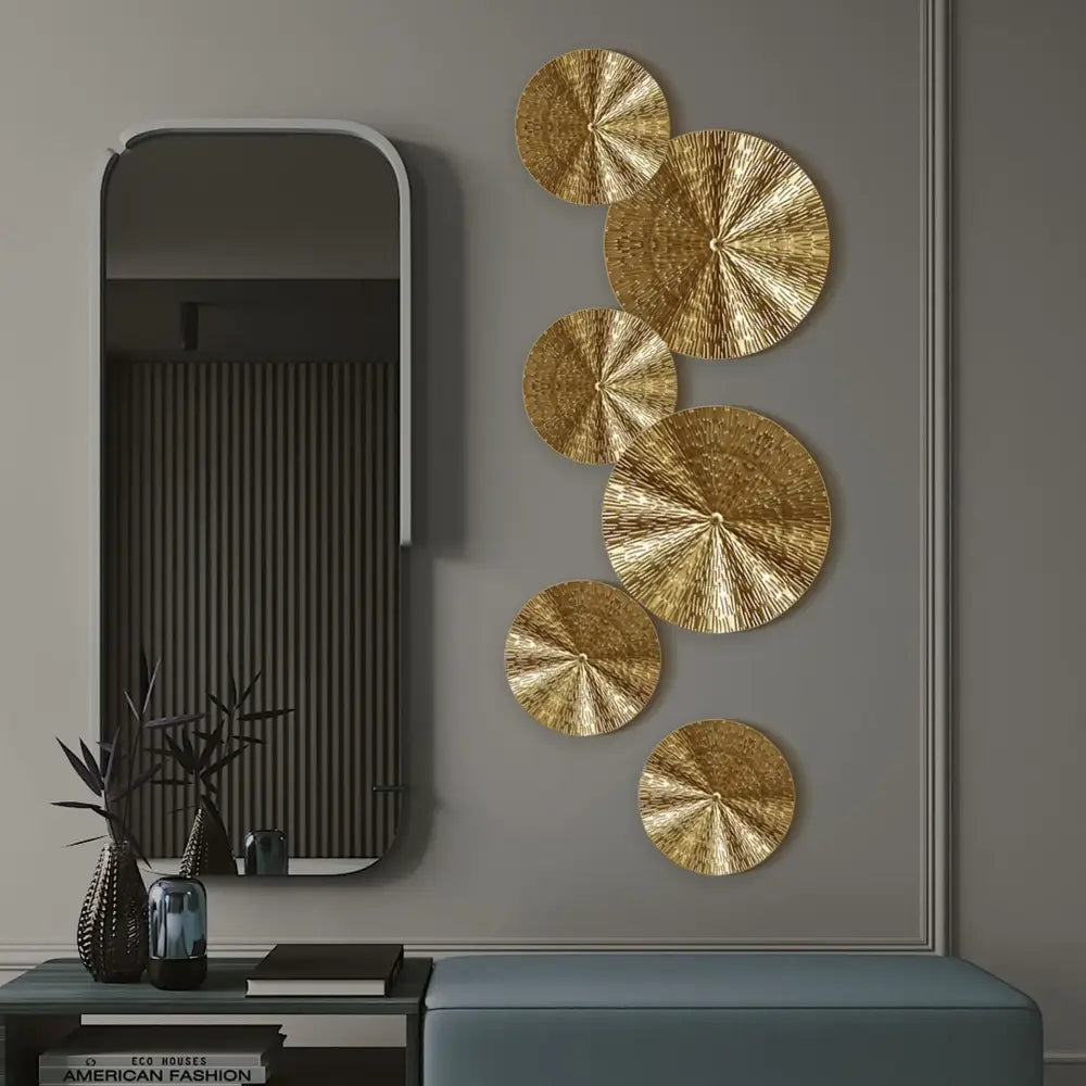 Golden metal wall art featuring a geometric golden metal textured fan-like circular design for living room decorbites decor