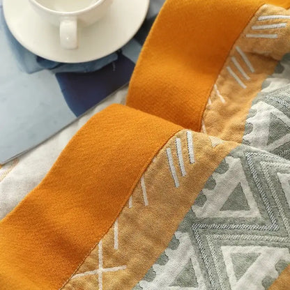 Orange and gray geometric-patterned decorbites cotton gauze geometry summer blanket with white stitched accents for bedroom decor