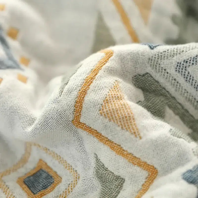A soft white cotton gauze geometry summer blanket with subtle mustard and gray patterns for bedroom decorbites cotton gauze