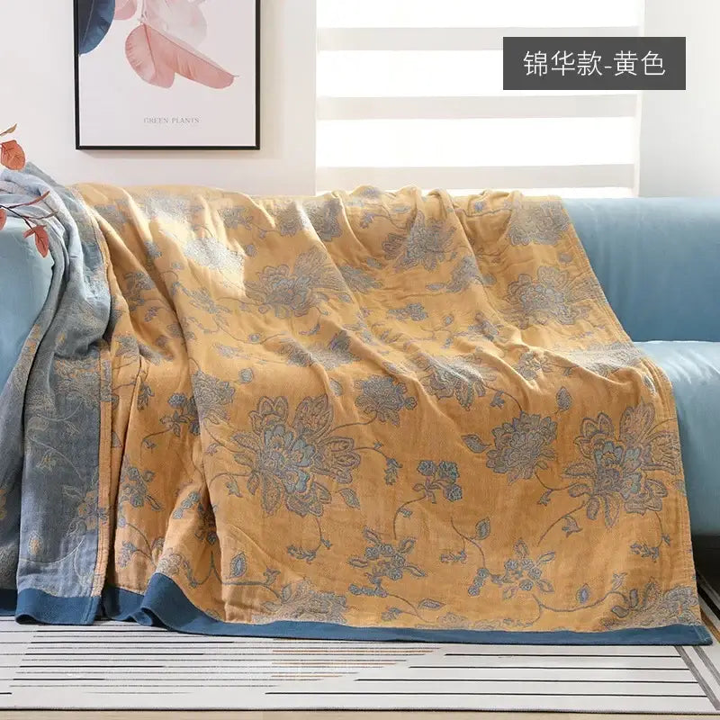 Yellow floral-patterned decorbites cotton gauze geometry summer blanket with blue accents and soft textured fabric