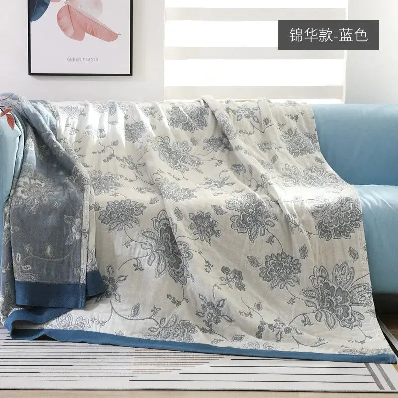 A soft blue and gray floral-patterned cotton gauze geometry summer blanket with subtle sheen for bedroom decorbites cotton gauze