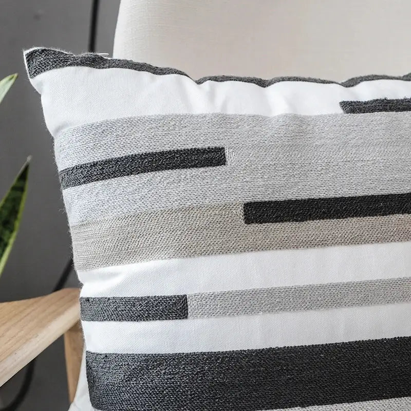 Rectangular pillow cover with decorbites grey embroidered cotton fabric featuring woven horizontal stripes in grey tones