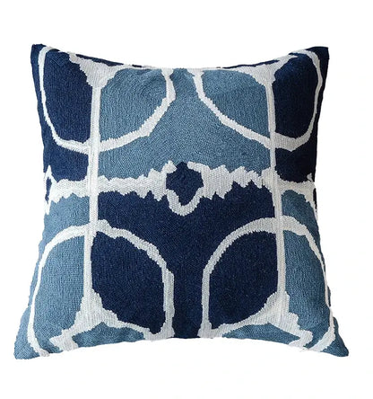 A square pillow cover with a navy blue and white geometric grey embroidered cotton design for living room decor