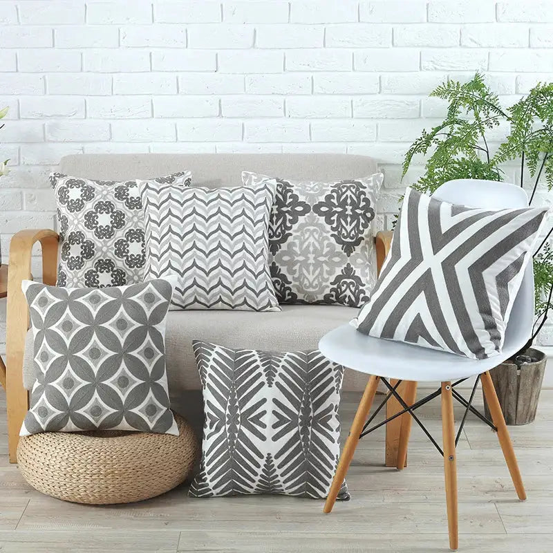 Set of six grey and white patterned cushion covers with floral geometric and chevron designs by decorbites grey pink