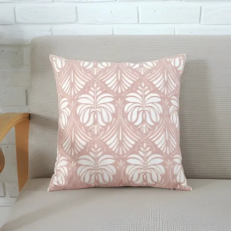 A soft pink cushion cover with white floral pattern on beige sofa decorbites grey pink geometric living room decor