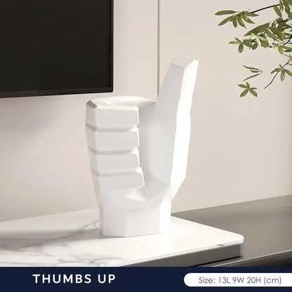 White geometric thumbs-up hand sculpture in matte gray black and white gesture art decor for living room set
