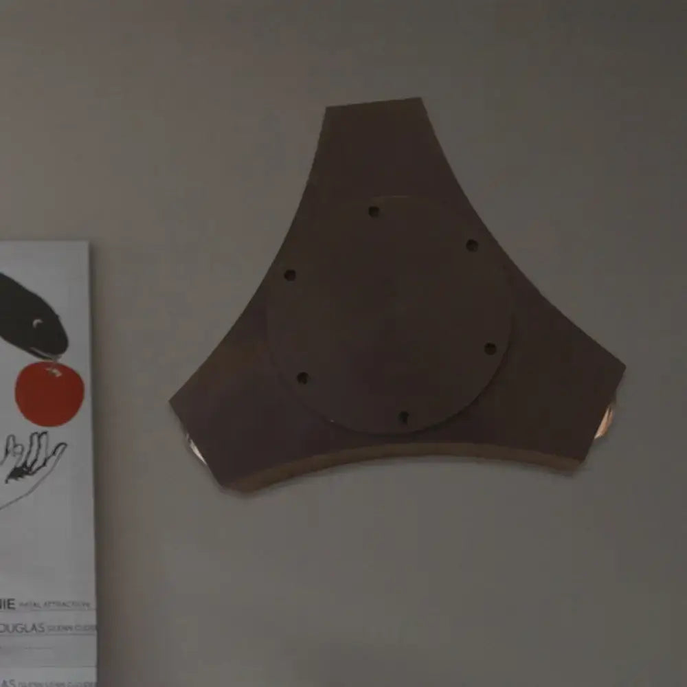 Bronze geometric metallic shade wall sconce featuring a triangular design with central circular plate and holes for corridor or bedroom lighting