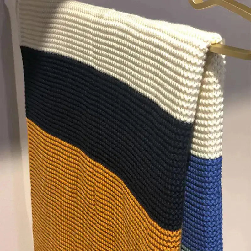 A decorbites knitted chenille scarf with cream navy mustard and royal blue horizontal stripes