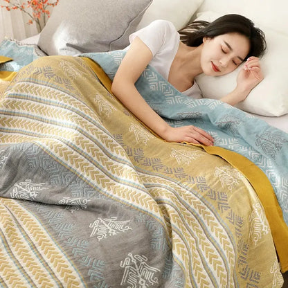 A cozy geometric mustard and gray cotton gauze summer blanket by decorbites with a multi-colored pattern