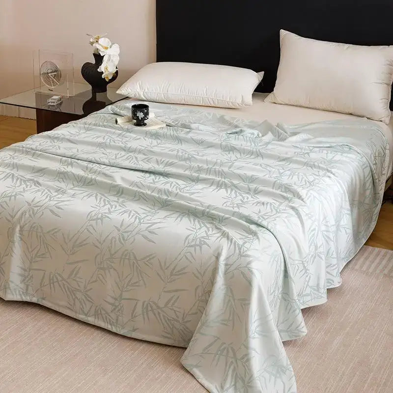 Light blue satin bedspread with subtle bamboo leaf pattern made of decorbites bamboo fiber summer bedding
