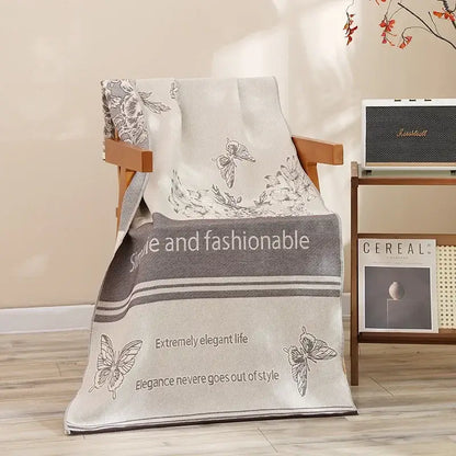 A soft off-white decorbites cotton bath towel with gray butterfly pattern and style and fashionable text for quick drying