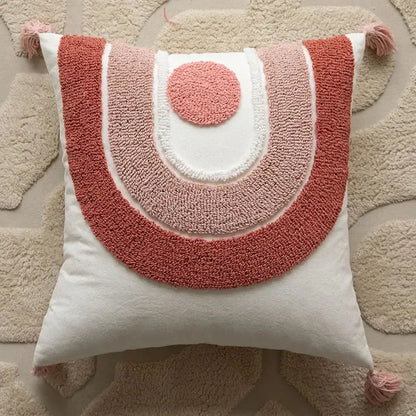 A cozy square geometric embroidered pillow cover in coral and blush pink with tassels for living room decorbites cushion covers