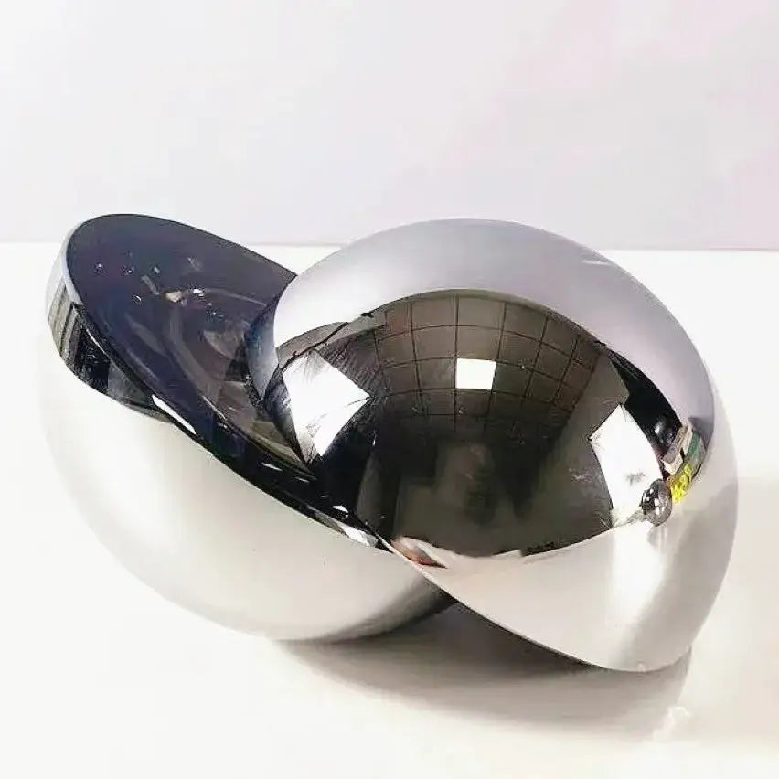Shiny chrome and black mirrored spherical glass ball home decor figurine with reflective surfaces for living room