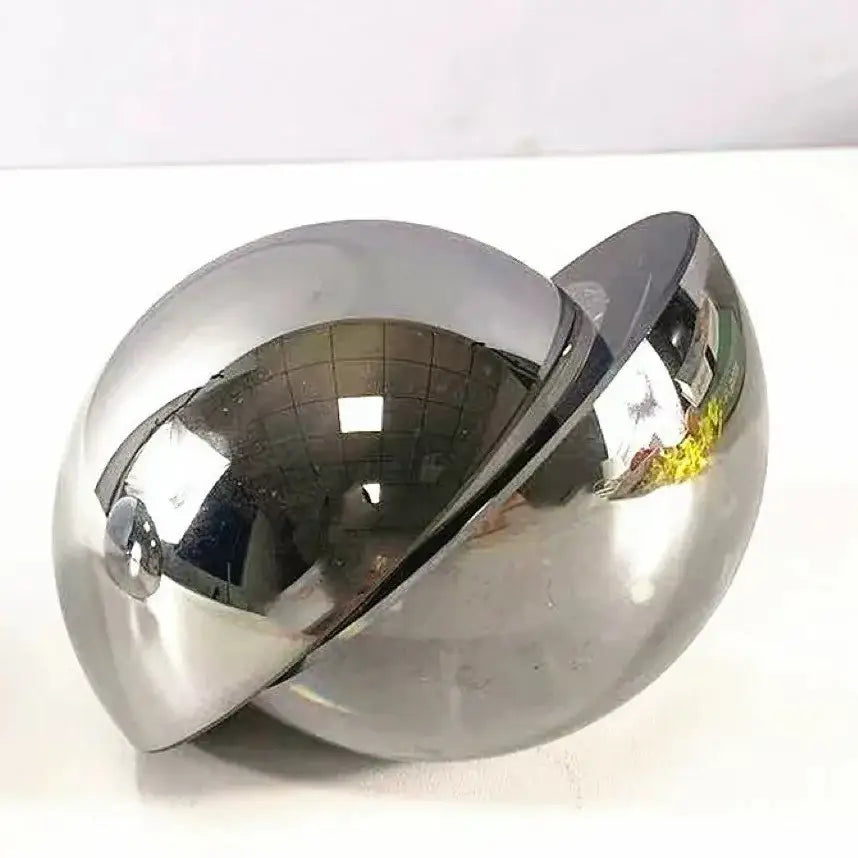 Shiny chrome-finished spherical silver metallic glass home decor figurine with reflective interlocking design for living room