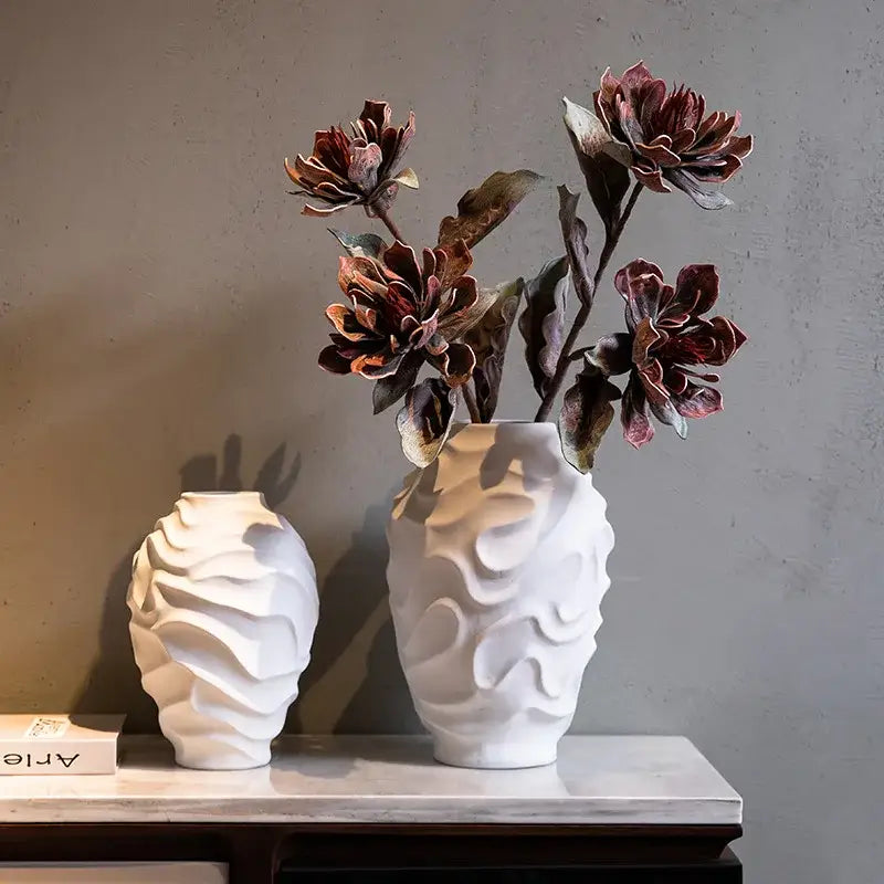 White ceramic vase with a geometric spiral textured surface for home decor and fruit platter display
