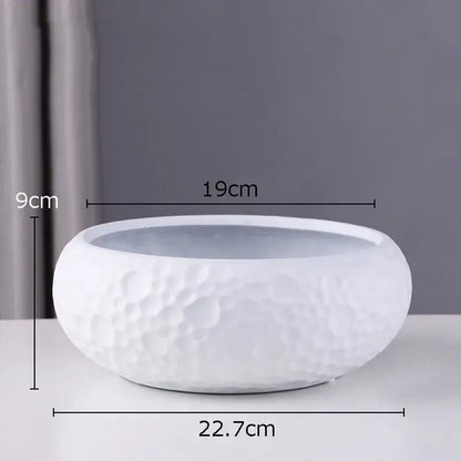 White ceramic vase with a textured hammered surface and smooth rim for minimalist ceramic vase decorbites decor