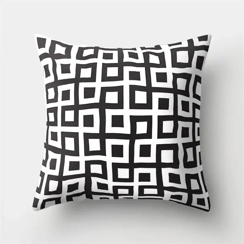Square pillow cover with bold black and white geometric star pattern perfect for home decor by decorbites geometric star