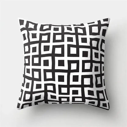 Square pillow cover with bold black and white geometric star pattern perfect for home decor by decorbites geometric star