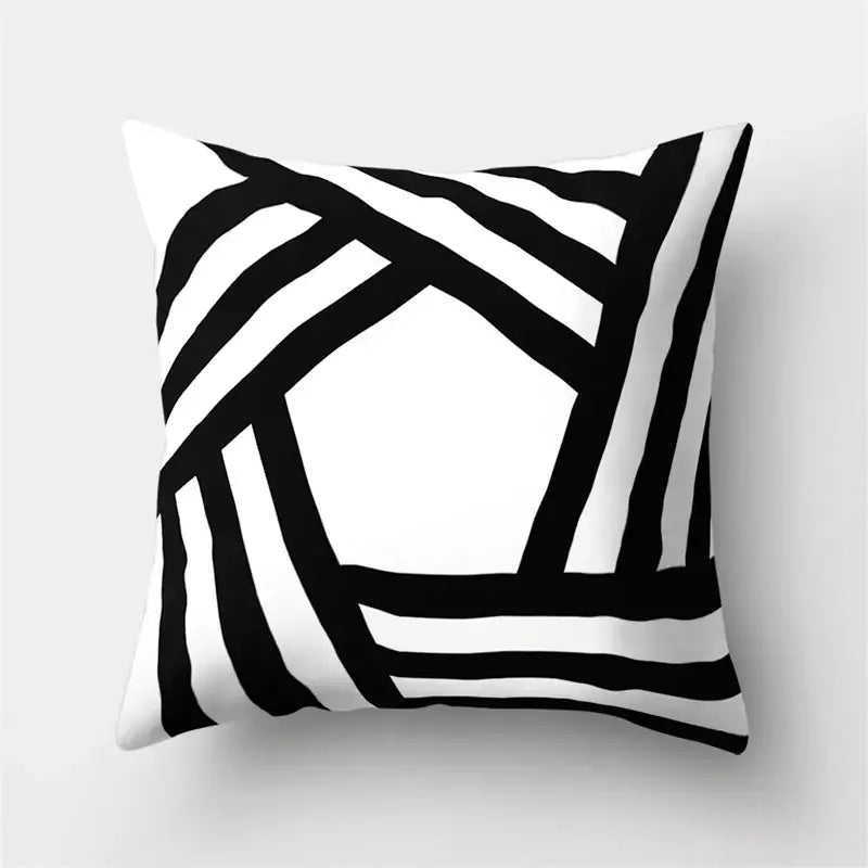 Square throw pillow cover with bold black and white geometric star print for home decor by decorbites