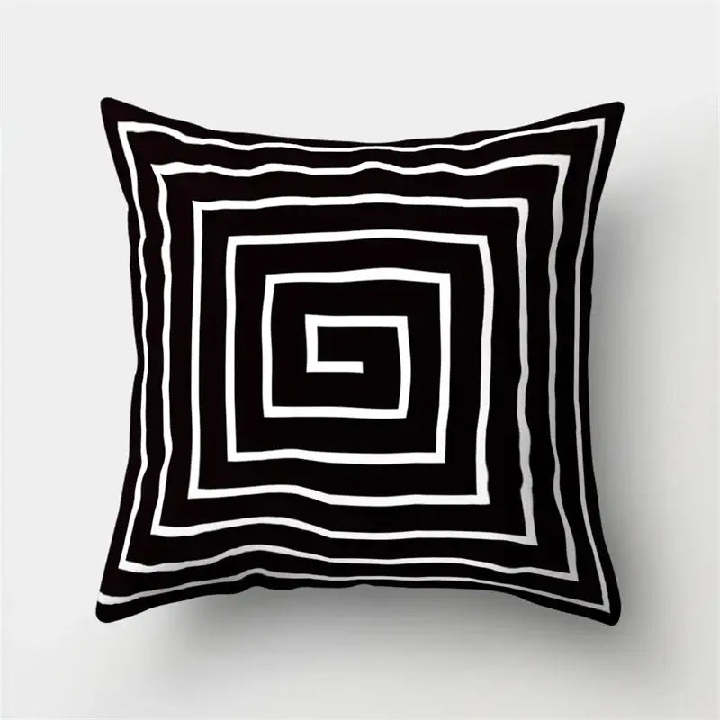 Black and white pillow cover with geometric star print featuring concentric square patterns for home decor by decorbites