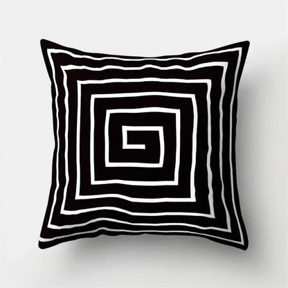 Black and white pillow cover with geometric star print featuring concentric square patterns for home decor by decorbites