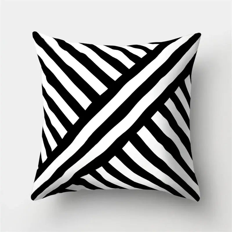 Square pillow cover with bold black and white diagonal stripes geometric star pattern for stylish home decor by decorbites
