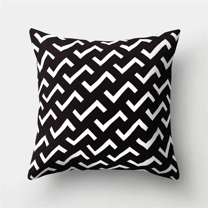 Black and white pillow cover with geometric star zigzag pattern for living room home decor by decorbites