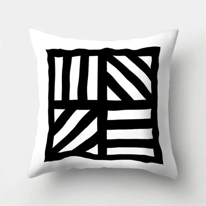 White throw pillow cover with bold black geometric star pattern for living room home decor by decorbites geometric star