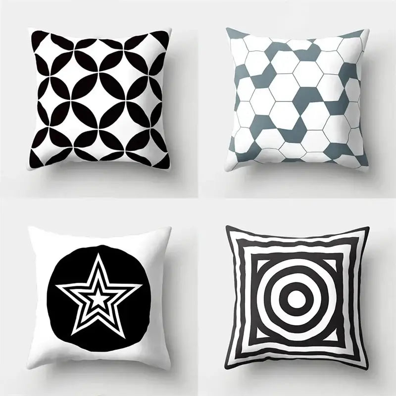 Four square pillow covers with bold black and white geometric star print for home decor by decorbites geometric star
