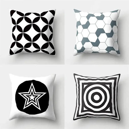 Four square pillow covers with bold black and white geometric star print for home decor by decorbites geometric star