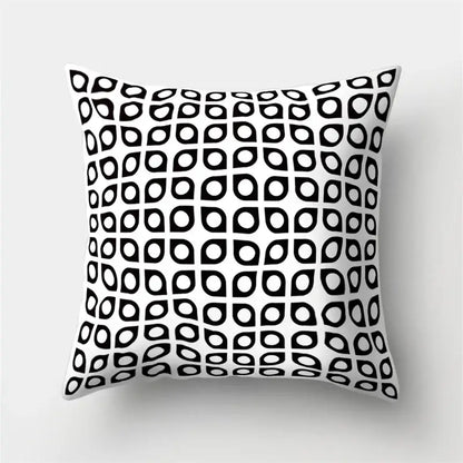 Square pillow cover with bold black and white teardrop geometric star pattern for home decor by decorbites geometric star